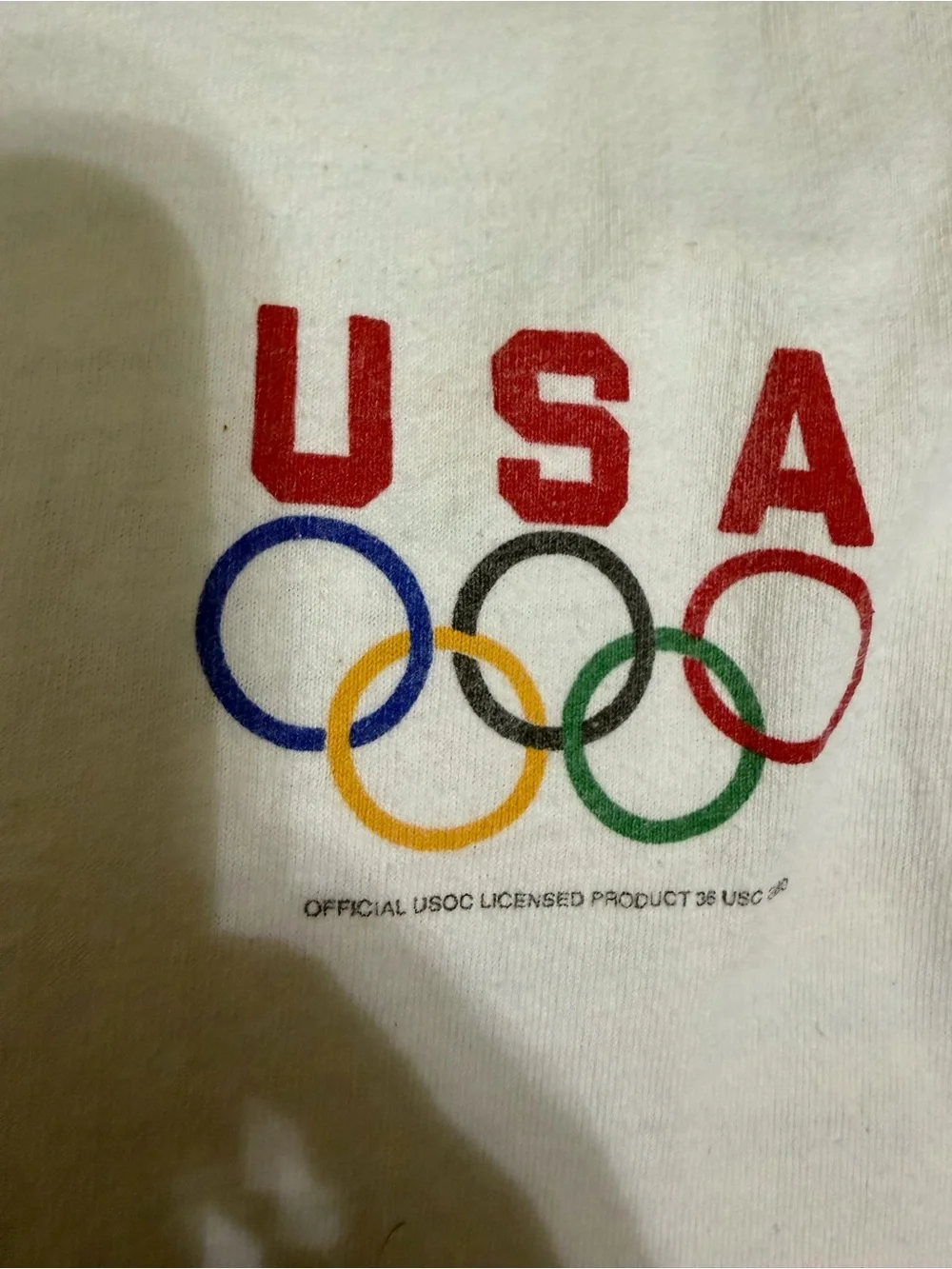 vintage 1996 Atlanta Olympics white cotton t-shirt features a vibrant grid of in